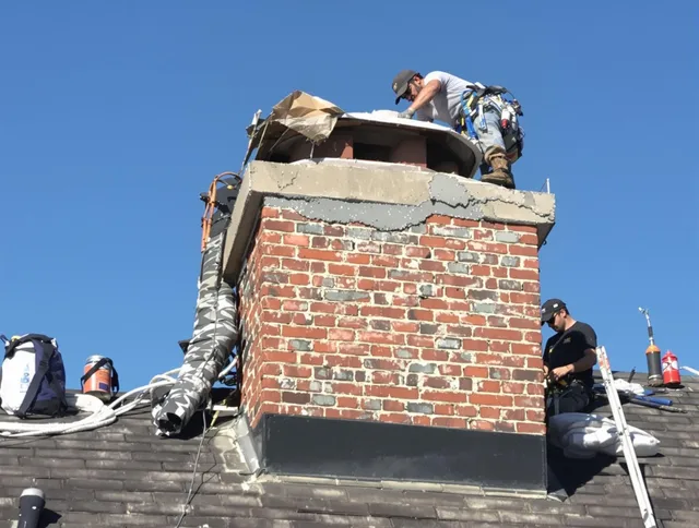 Windsor Locks Chimney Sweep installing a custom chimney crown in Windsor Locks, CT