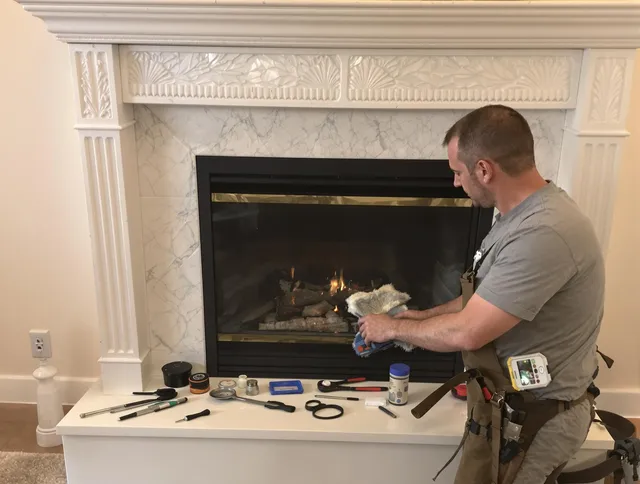 Windsor Locks Chimney Sweep performing fireplace maintenance in Windsor Locks, CT