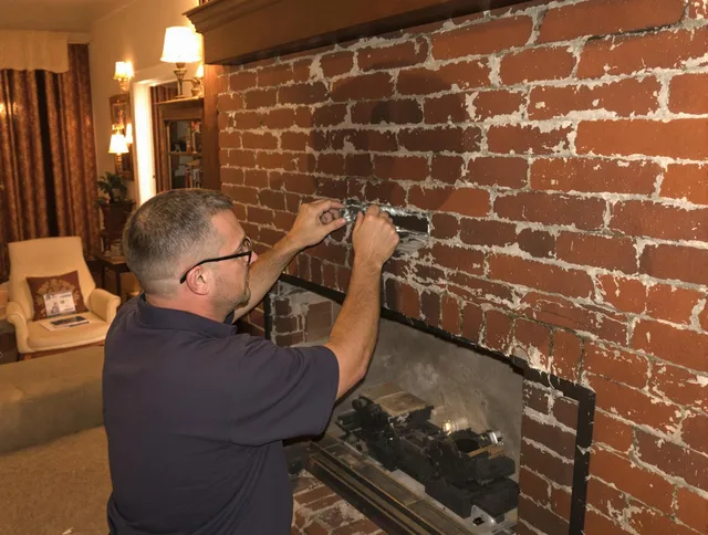 Windsor Locks Chimney Sweep expert fixing a fireplace in Windsor Locks, CT